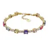 Pulsera plata chapada en oro con piedras multicolor.